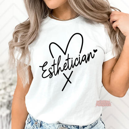 White unisex t-shirt featuring a minimalist black Esthetician heart script design, ideal for estheticians, skincare experts, facialists, and spa staff.