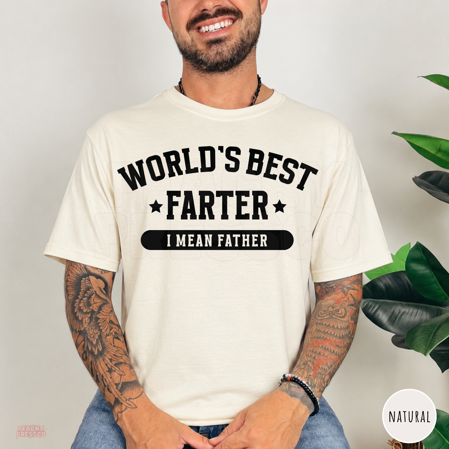 Natural t-shirt featuring the World's Best Farter I Mean Father graphic with bold black text, a humorous Father's Day shirt for dads.