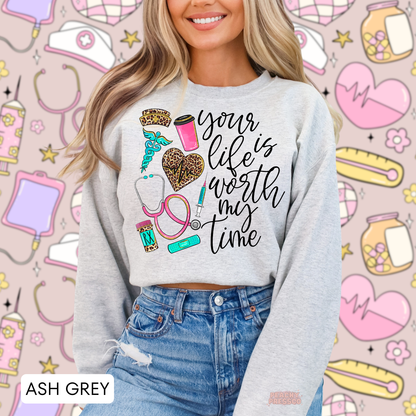 Ash grey nurse sweatshirt with inspirational Your Life Is Worth My Time quote, leopard heart, turquoise medical symbols and pink stethoscope.